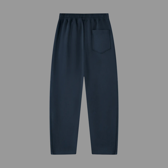 A pair of dark navy blue sweatpants with an elastic waistband and a side pocket, shown flat against a solid white background.