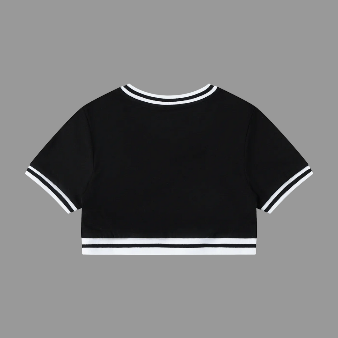 Black crop top with white trim on a white background