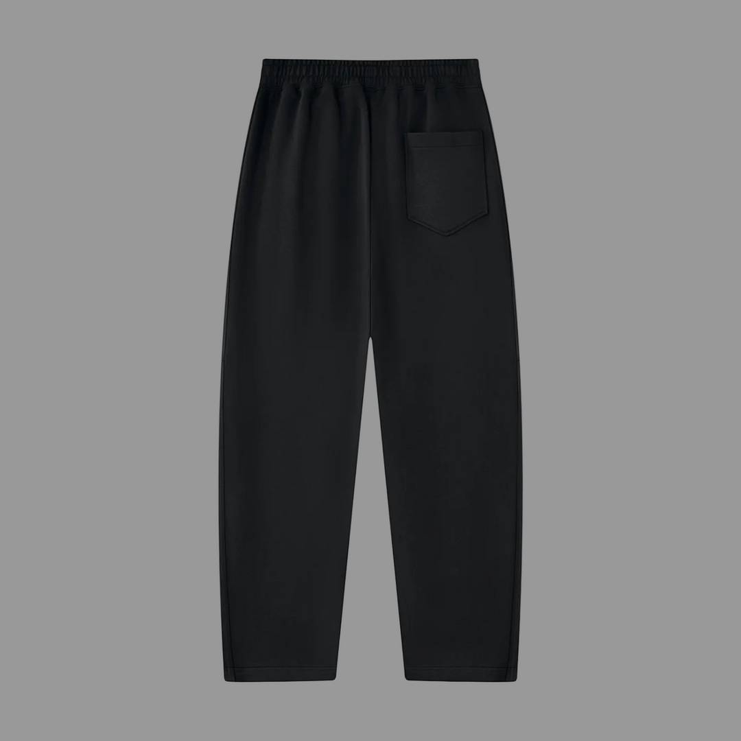 Black wide-leg sweatpants with an elastic waistband and a single patch pocket on the left side, shown against a plain white background.