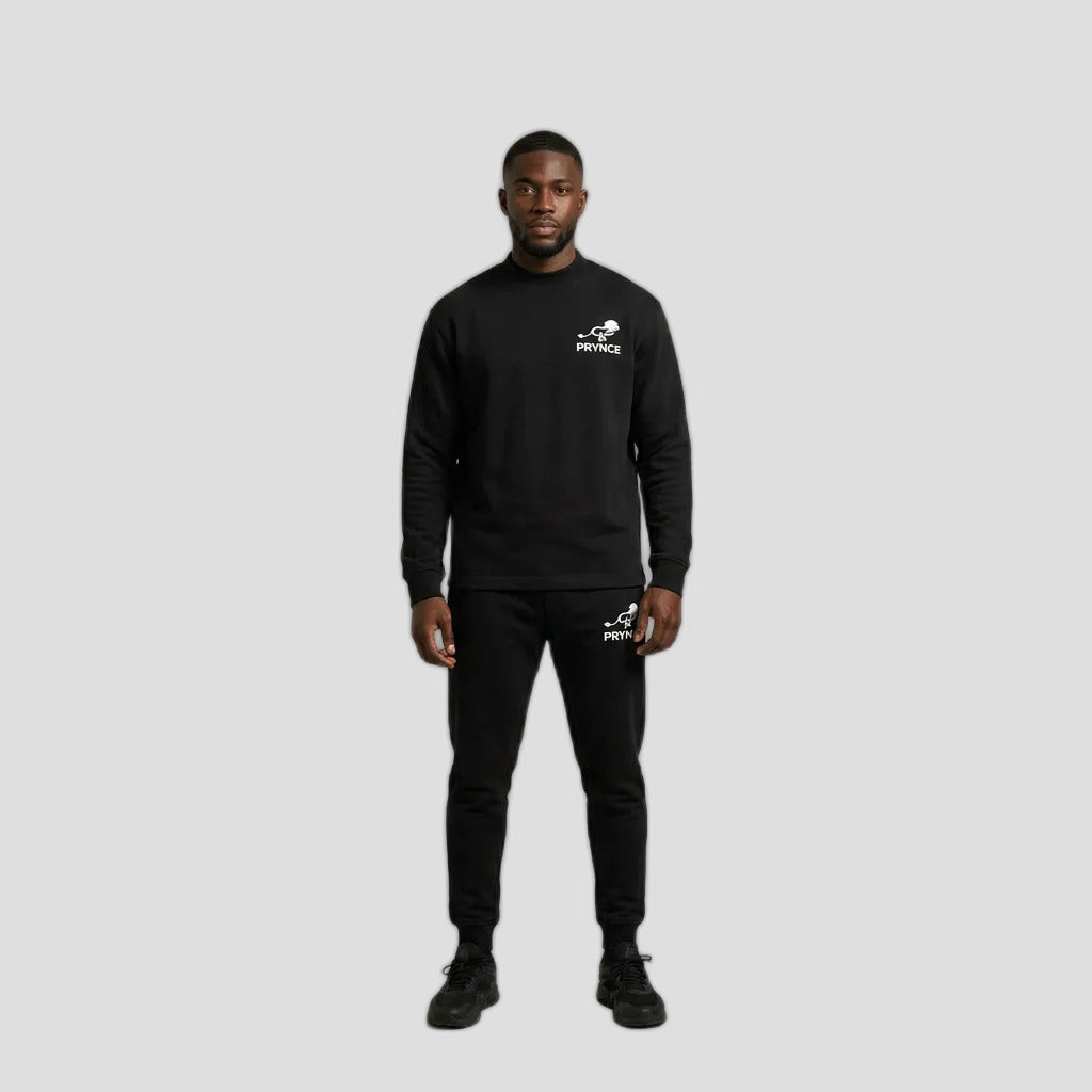 Man wearing the PRYNCE Athletics Mockneck Long Sleeve in black with small white chest logo, with black pants