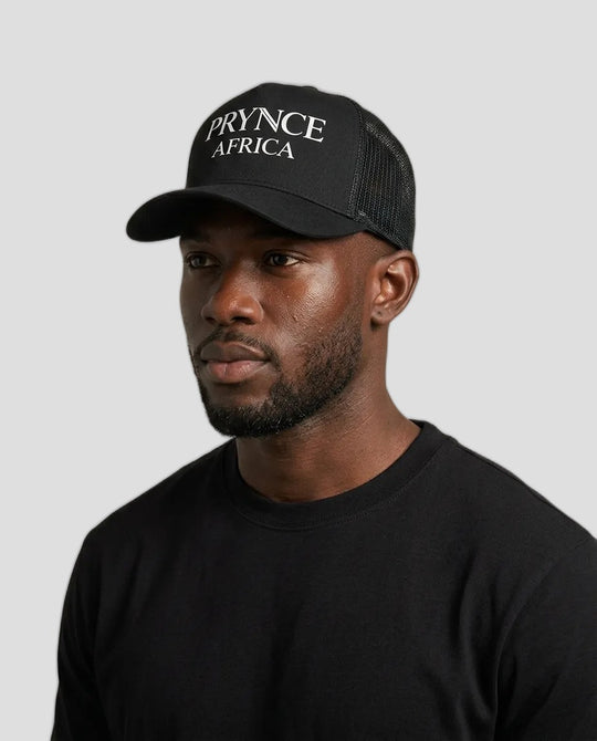A man wearing a black trucker hat with &
