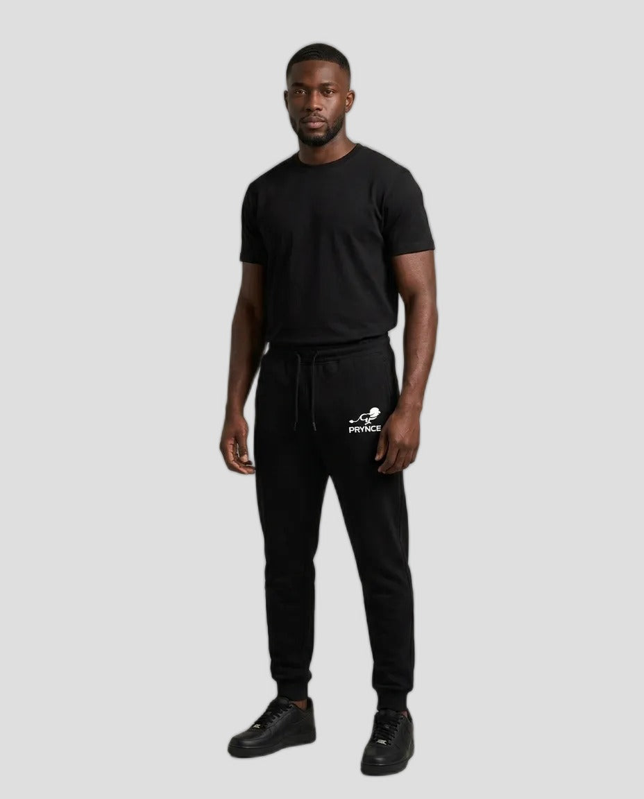 Man wearing PRYNCE Athletics Joggers in black with a small white logo on the thigh, with a black t-shirt