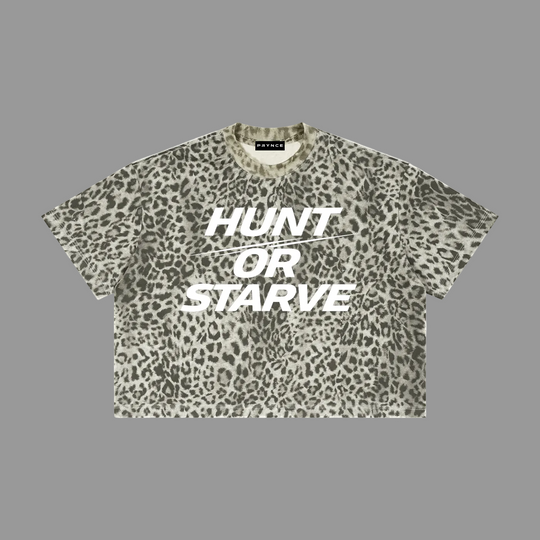 A short-sleeve crop top t-shirt with an olive green and beige leopard print pattern, featuring the text &