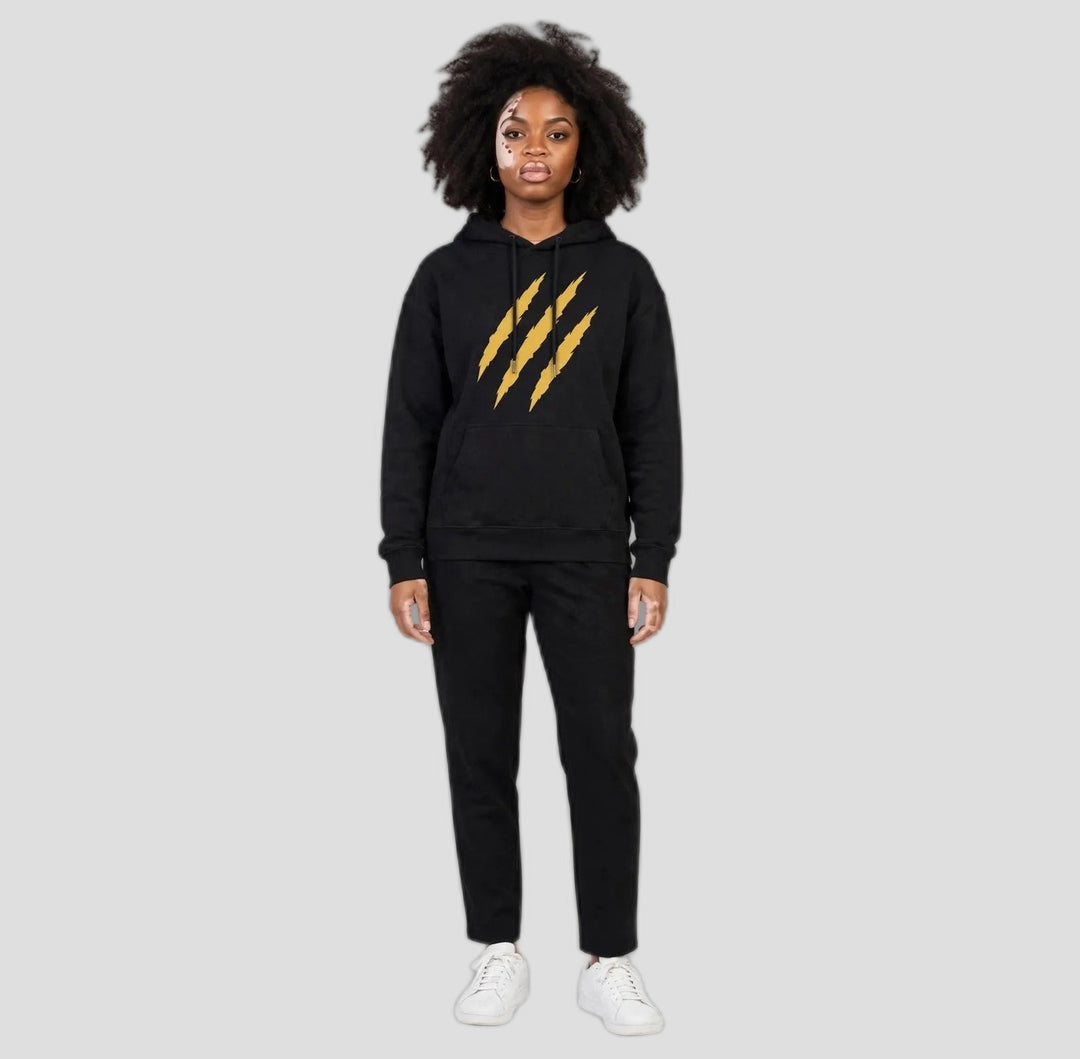 Camila wearing the PRYNCE Claw Marks Hoodie in black with gold claw marks on the chest, full body