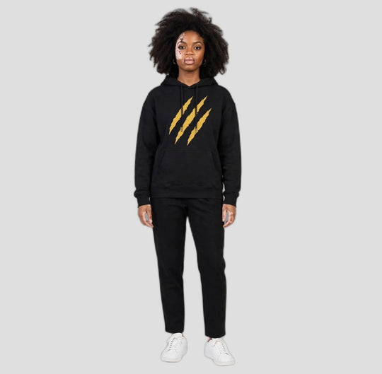 Camila wearing the PRYNCE Claw Marks Hoodie in black with gold claw marks on the chest, full body
