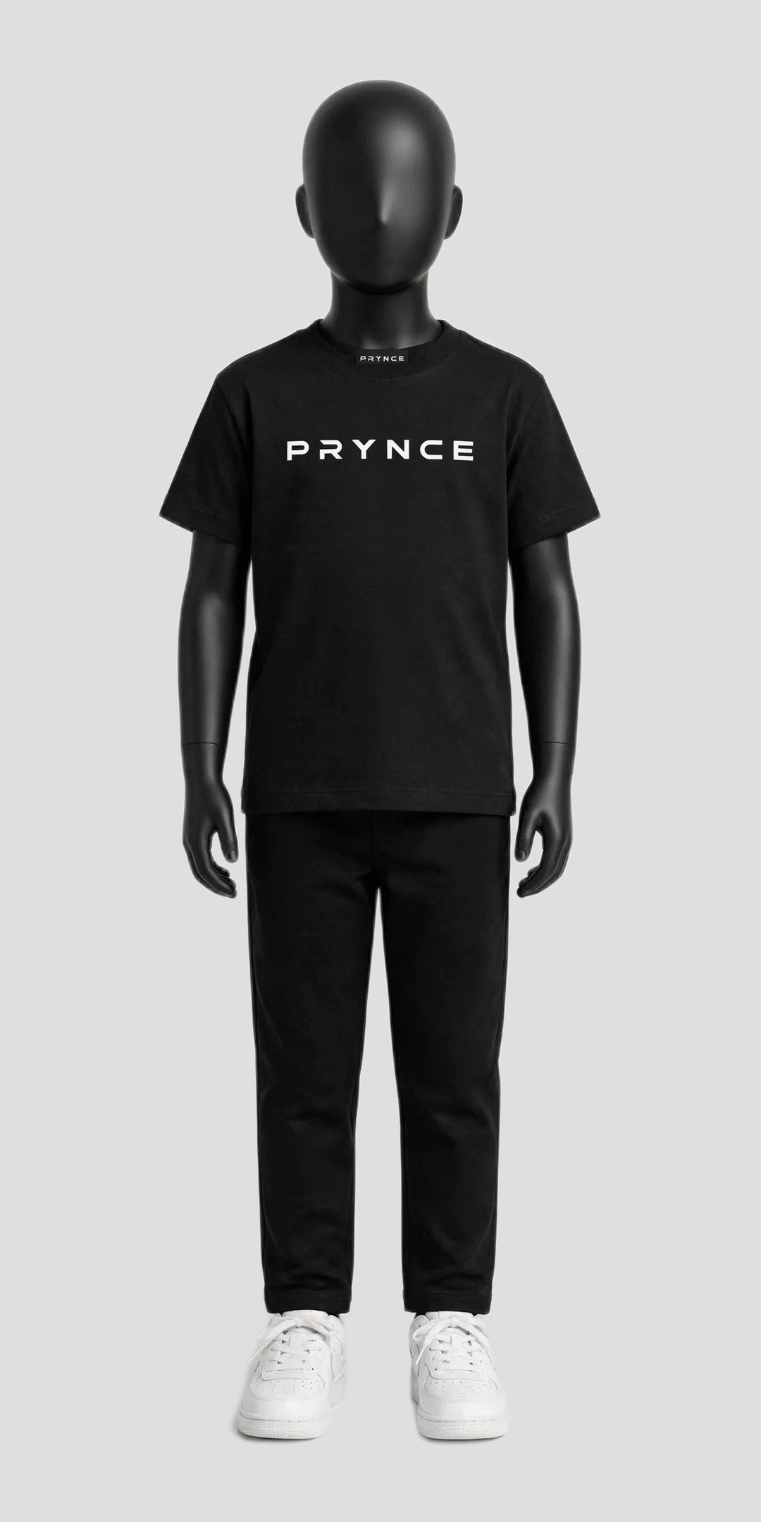 PRYNCE Cubs Essential Tee in black with white PRYNCE logo on a black kids mannequin, full body