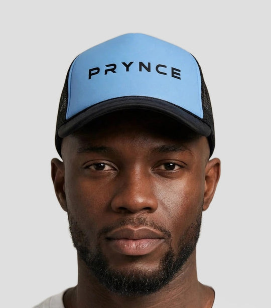 Chris wearing the PRYNCE Sky Wordmark Foam Trucker Hat — sky blue foam trucker hat with black PRYNCE wordmark print