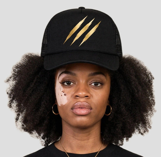 Camila wearing the PRYNCE Claw Marks Foam Trucker Hat — black foam trucker with gold claw marks print