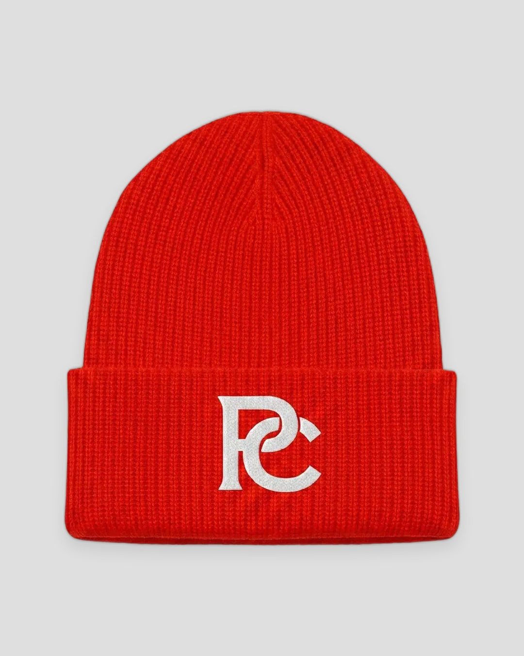 PC Signature Knit Beanie in red with a white interlocked PC monogram on the cuff