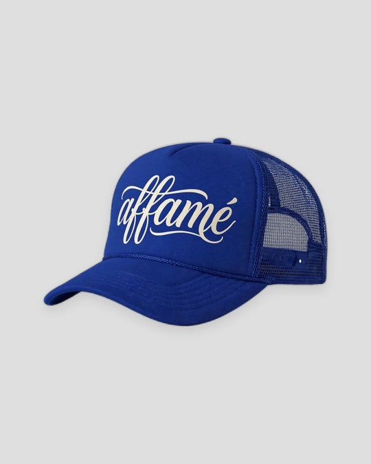 PRYNCE affamé Royal Mesh Trucker Hat in royal blue with cream affamé script on the front