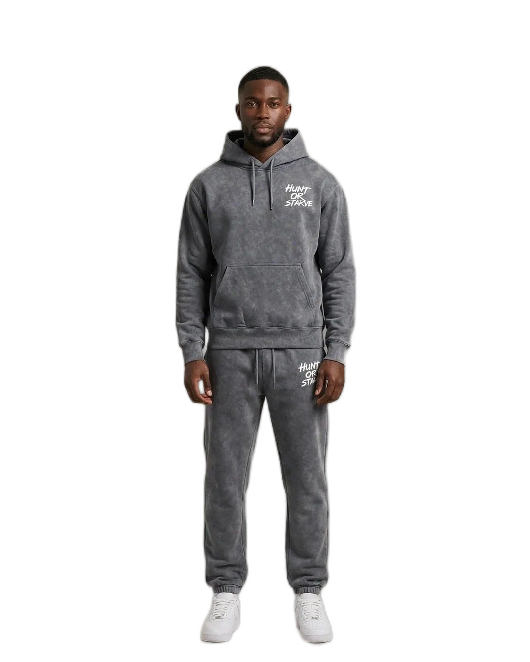Chris wearing the Endurance H.O.S Mineral Wash Set — grey mineral wash hoodie and sweatpants with Hunt or Starve hits
