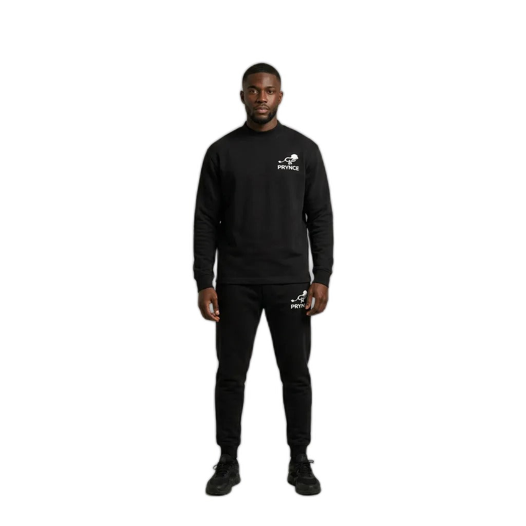 Man wearing the PRYNCE Athletics Mockneck Long Sleeve in black with small white chest logo, with black pants