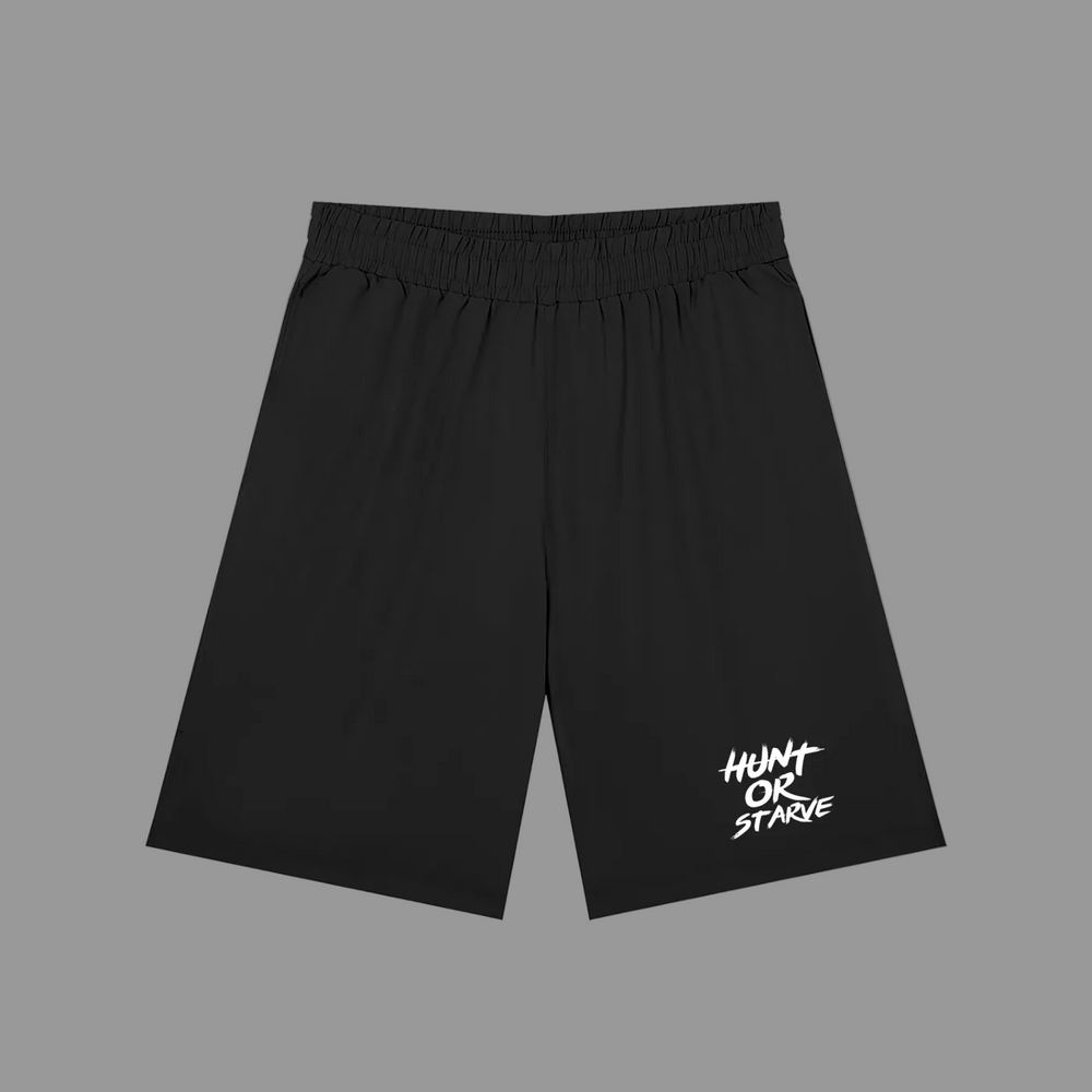 Black athletic shorts with an elastic waistband and a white 'HUNT OR STARVE' graphic on the lower left leg, shown against a plain white background.