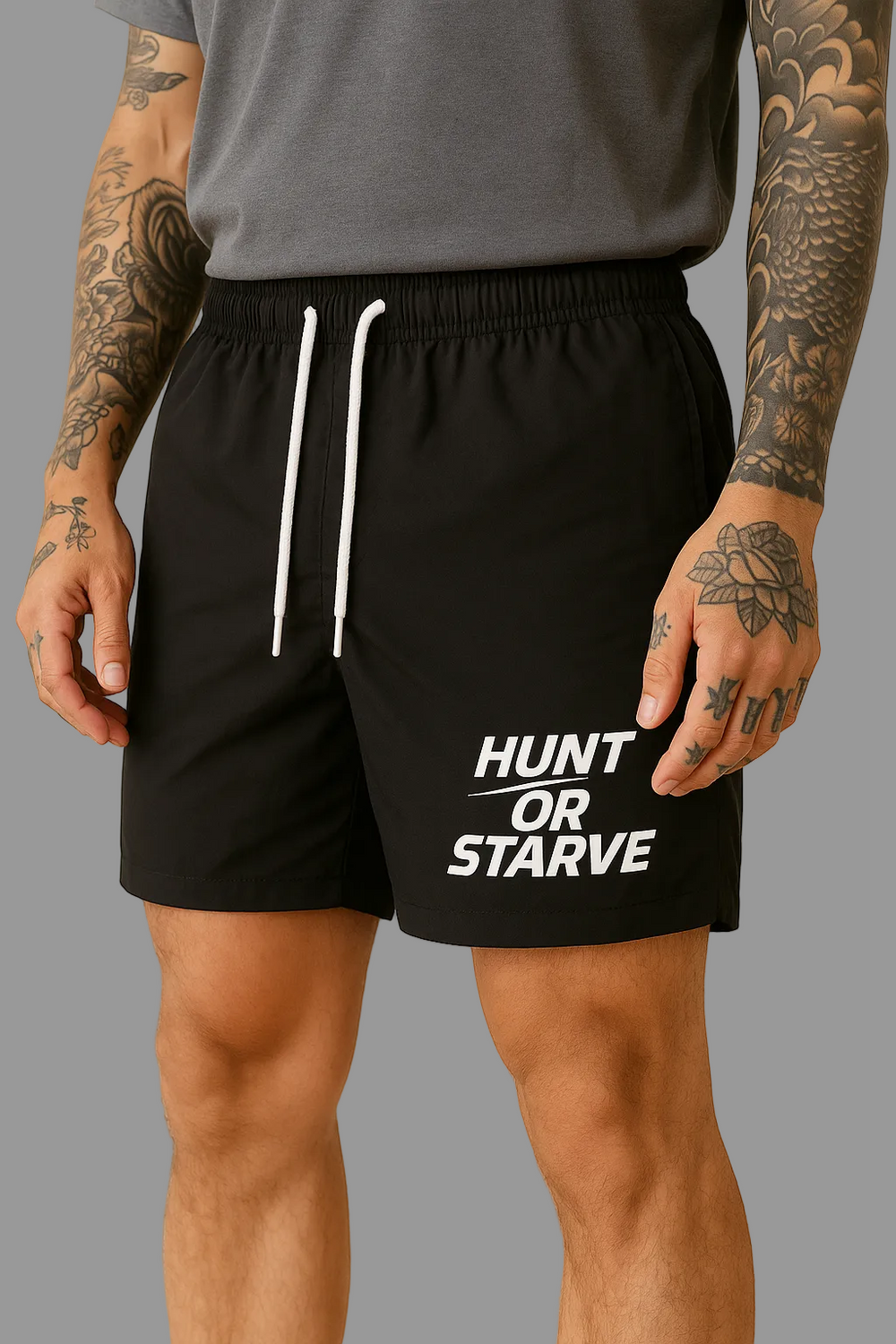 Person wearing black shorts with 'Hunt or Starve' text on a beige background