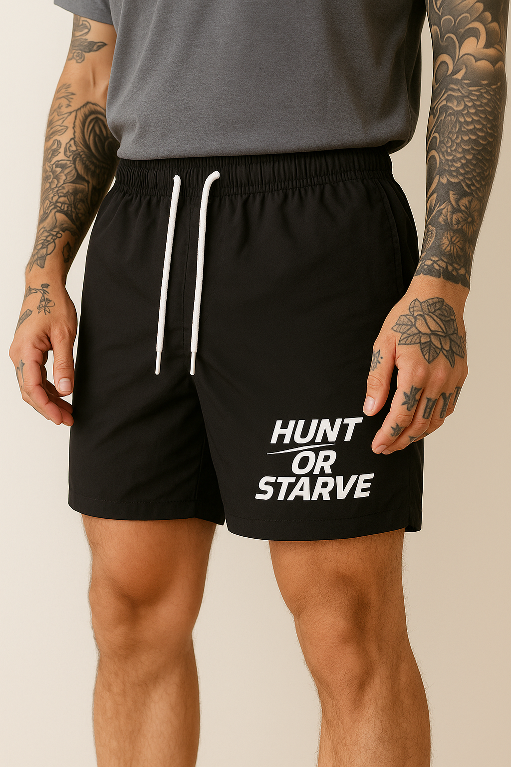 Person wearing black shorts with 'Hunt or Starve' text on a beige background