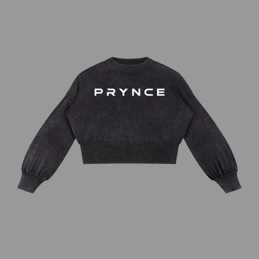 A black cropped knit sweater with 'PRYNCE' printed in white across the chest, displayed flat against a solid white background.