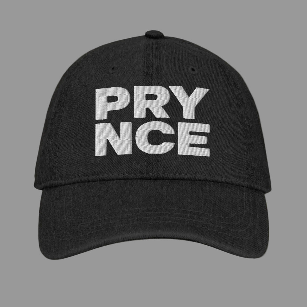 Black cap with 'PRYNCE' text on a mustard white background