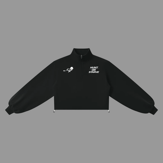 A black cropped quarter-zip jacket with white printed graphics on the chest, displayed flat against a solid white background.