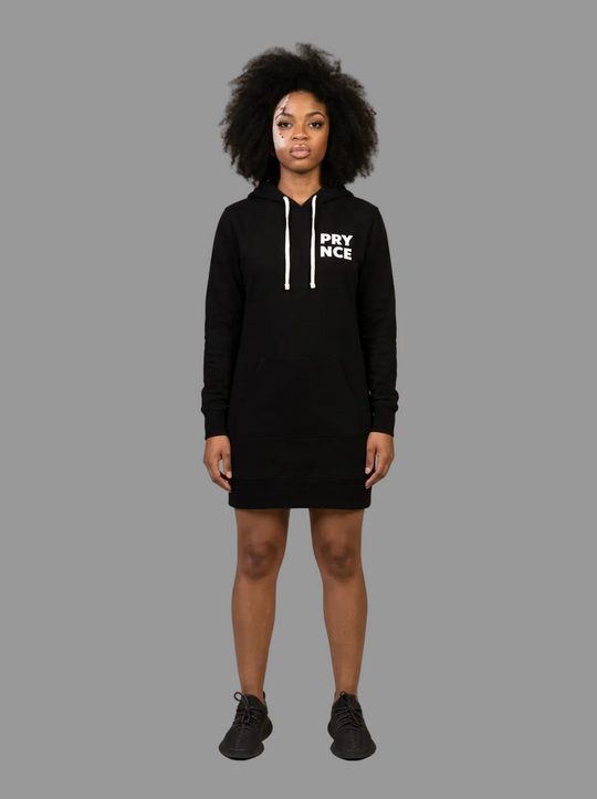 Model wearing the Prynce Hooded Pullover Dress, studio catalog photo