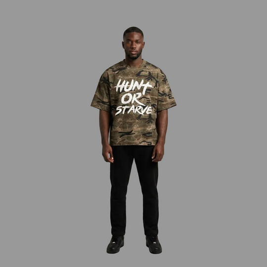 Model wearing the Hunt or Starve Stalker Camo Tee, PRYNCE studio catalog tile