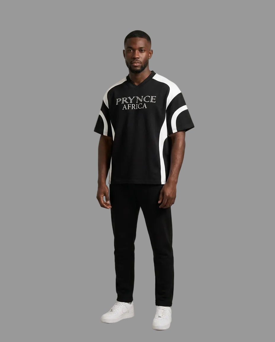 A man modeling a black short-sleeve t-shirt with white side panels and &
