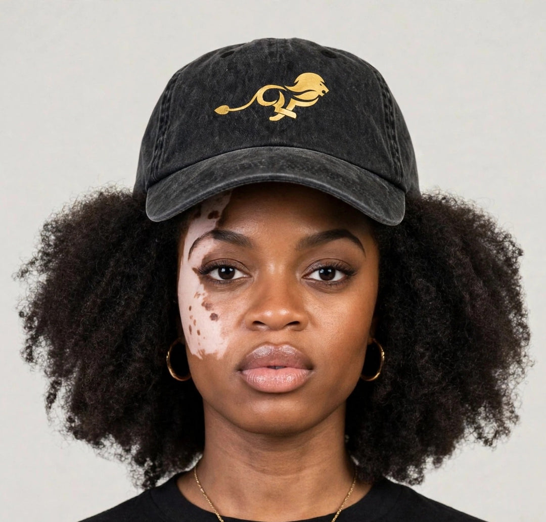 Camila wearing the PRYNCE Gold Lion Dad Cap — black washed dad cap with gold running lion print