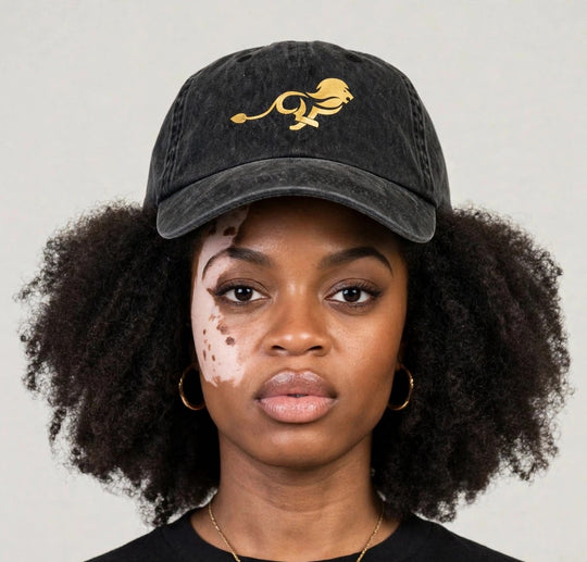 Camila wearing the PRYNCE Gold Lion Dad Cap — black washed dad cap with gold running lion print