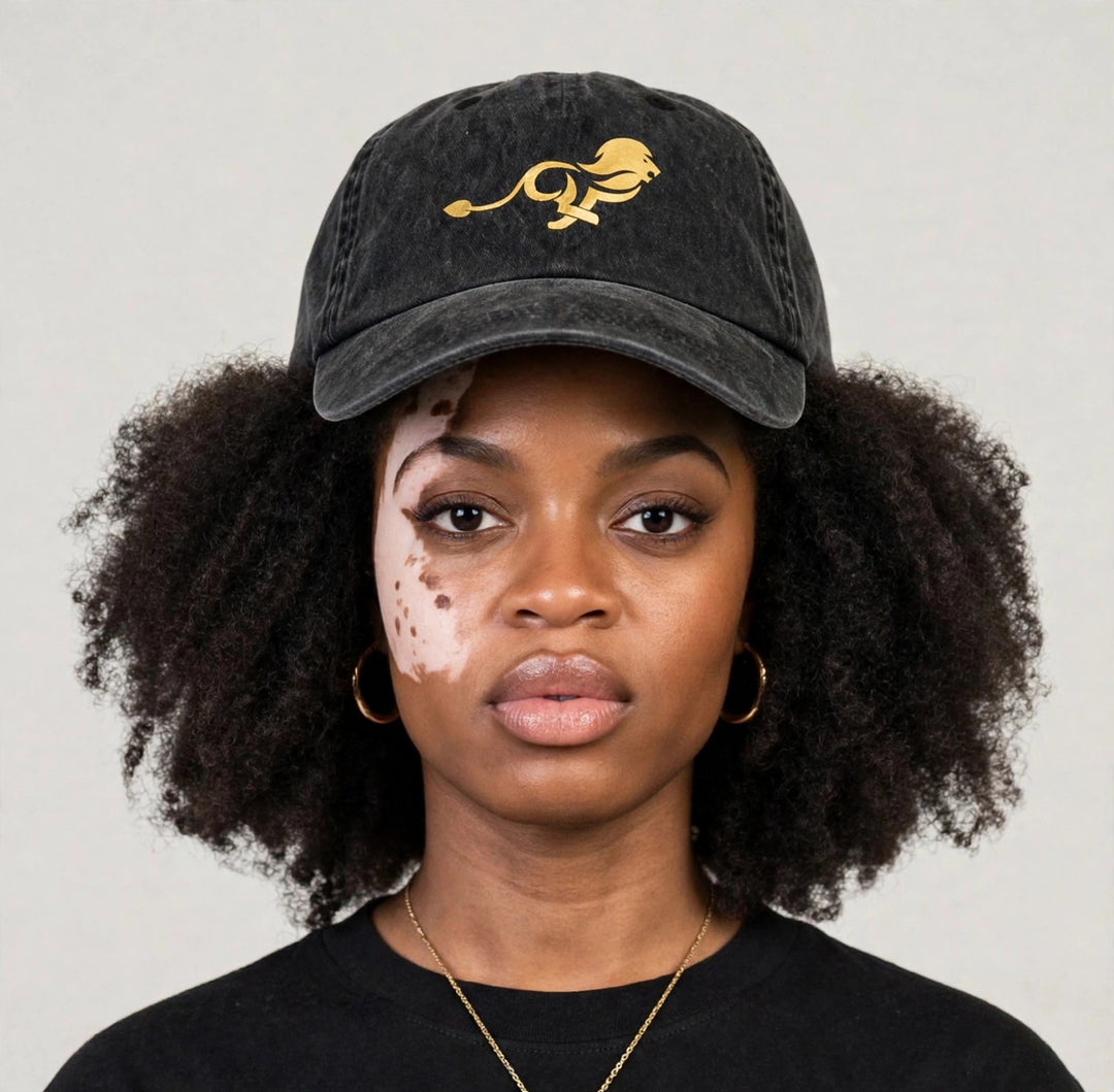 Camila wearing the PRYNCE Gold Lion Dad Cap — black washed dad cap with gold running lion print