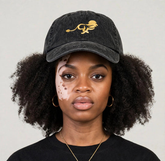 Camila wearing the PRYNCE Gold Lion Dad Cap — black washed dad cap with gold running lion print