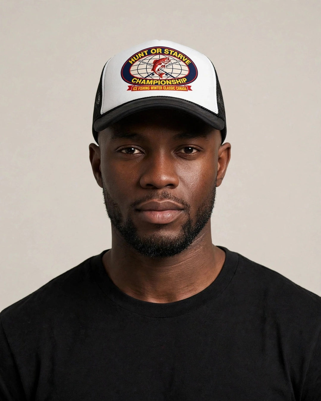 Chris wearing the Hunt or Starve Championship Foam Trucker Hat — black and white foam trucker with HUNT OR STARVE CHAMPIONSHIP ice fishing badge print