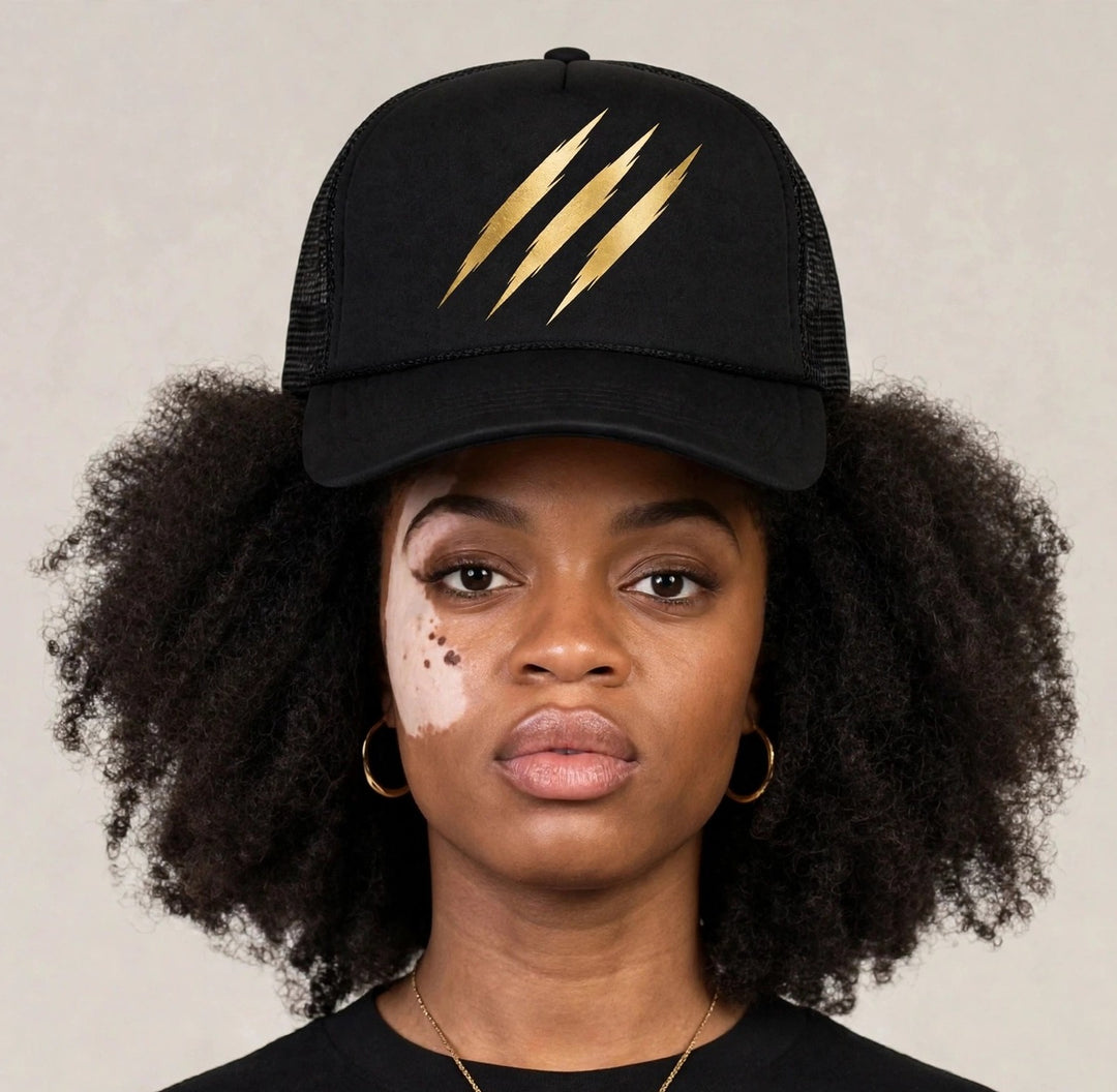 Camila wearing the PRYNCE Claw Marks Foam Trucker Hat — black foam trucker with gold claw marks print