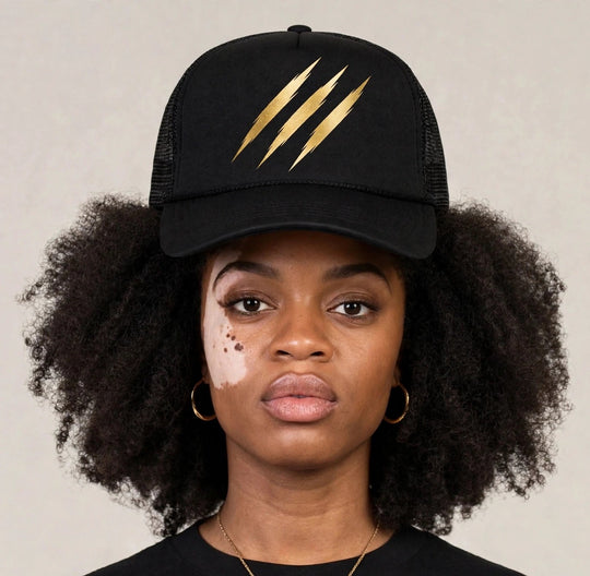 Camila wearing the PRYNCE Claw Marks Foam Trucker Hat — black foam trucker with gold claw marks print