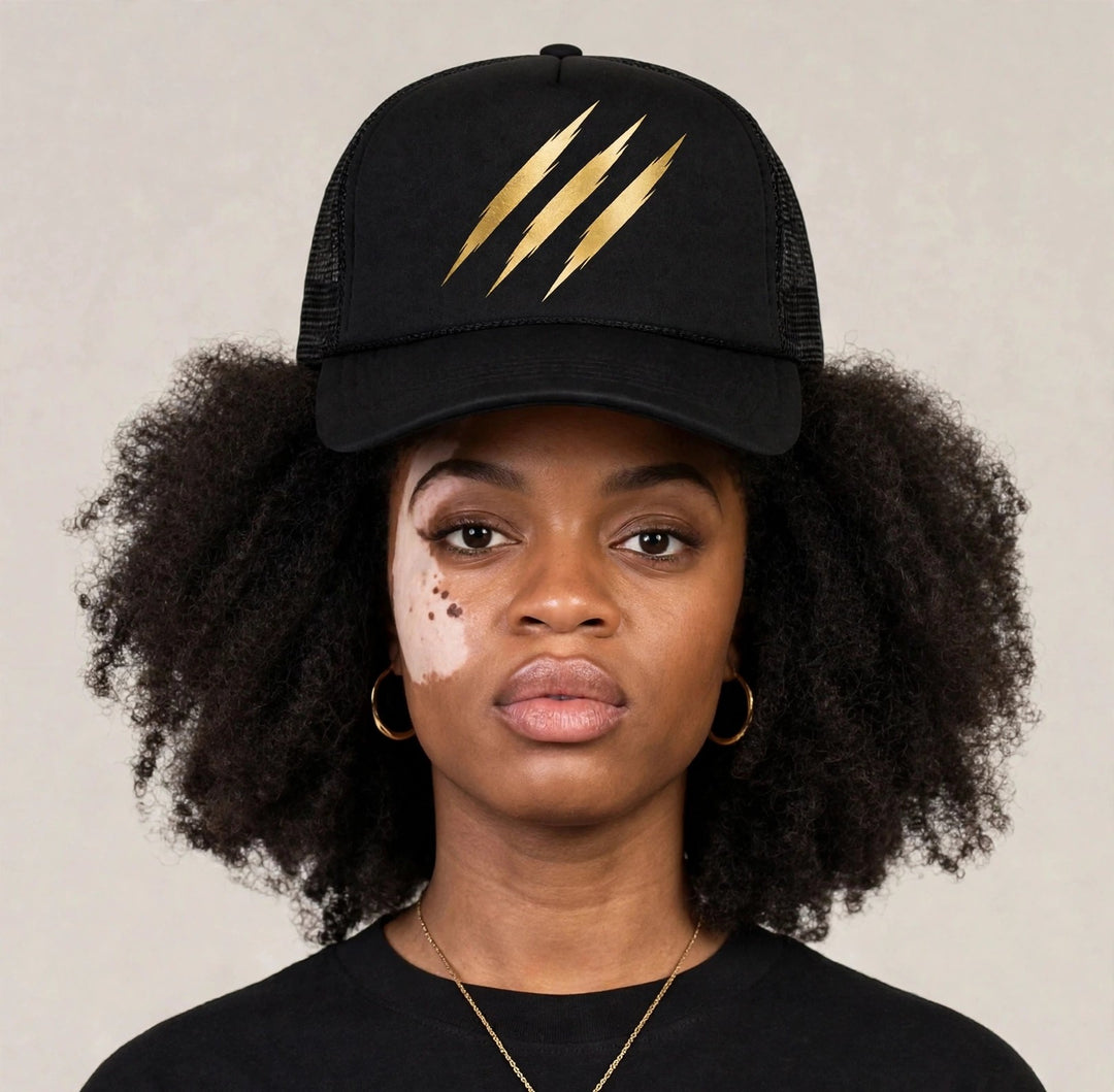 Camila wearing the PRYNCE Claw Marks Foam Trucker Hat — black foam trucker with gold claw marks print