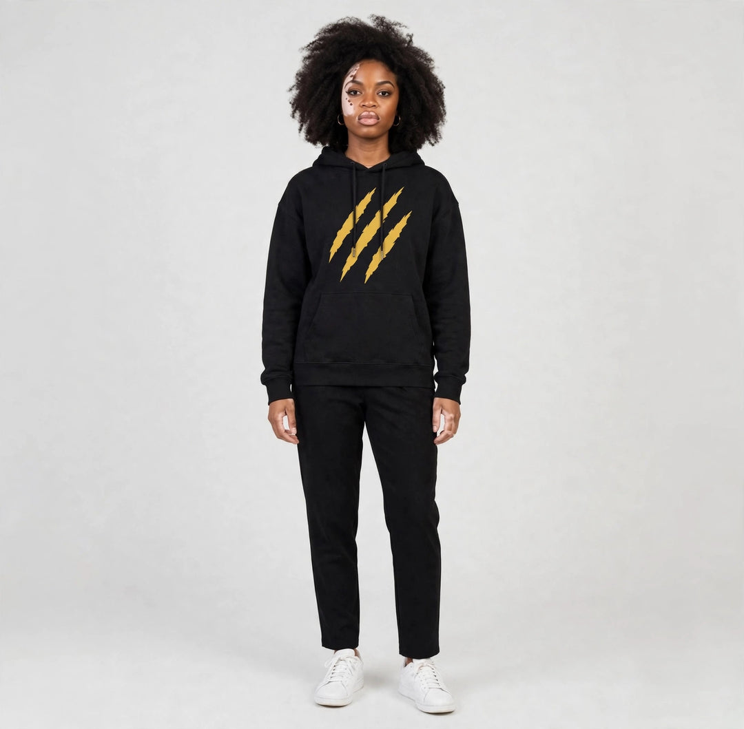 Camila wearing the PRYNCE Claw Marks Hoodie in black with gold claw marks on the chest, full body