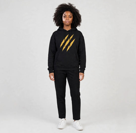 Camila wearing the PRYNCE Claw Marks Hoodie in black with gold claw marks on the chest, full body