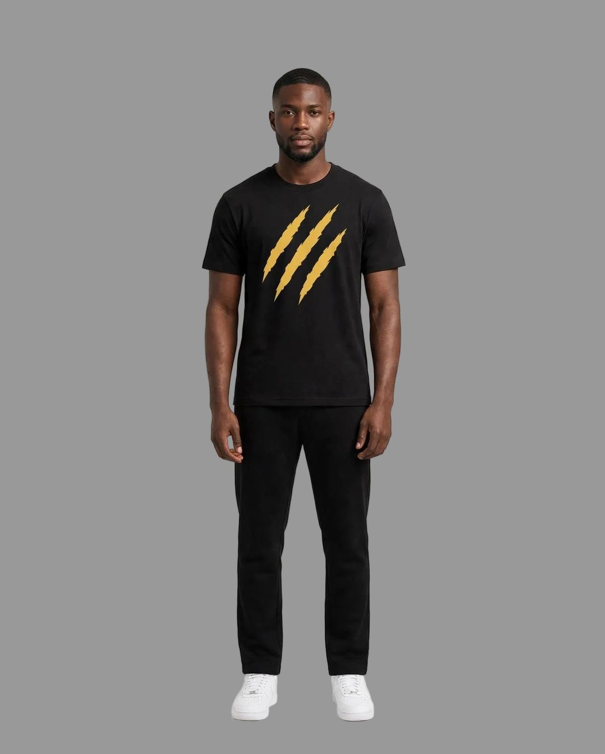 Chris wearing the PRYNCE Claw Marks Tee in black with gold claw marks on the chest, full body