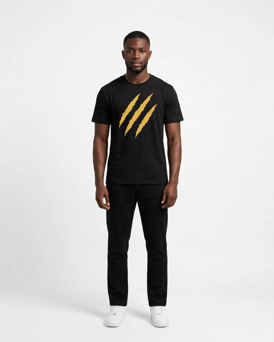 Chris wearing the PRYNCE Claw Marks Tee in black with gold claw marks on the chest, full body