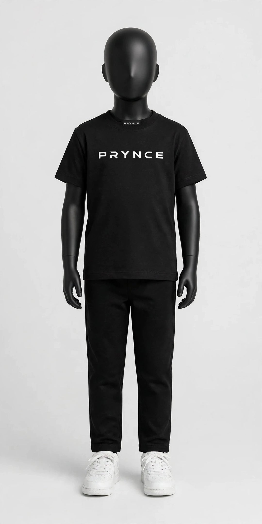 PRYNCE Cubs Essential Tee in black with white PRYNCE logo on a black kids mannequin, full body